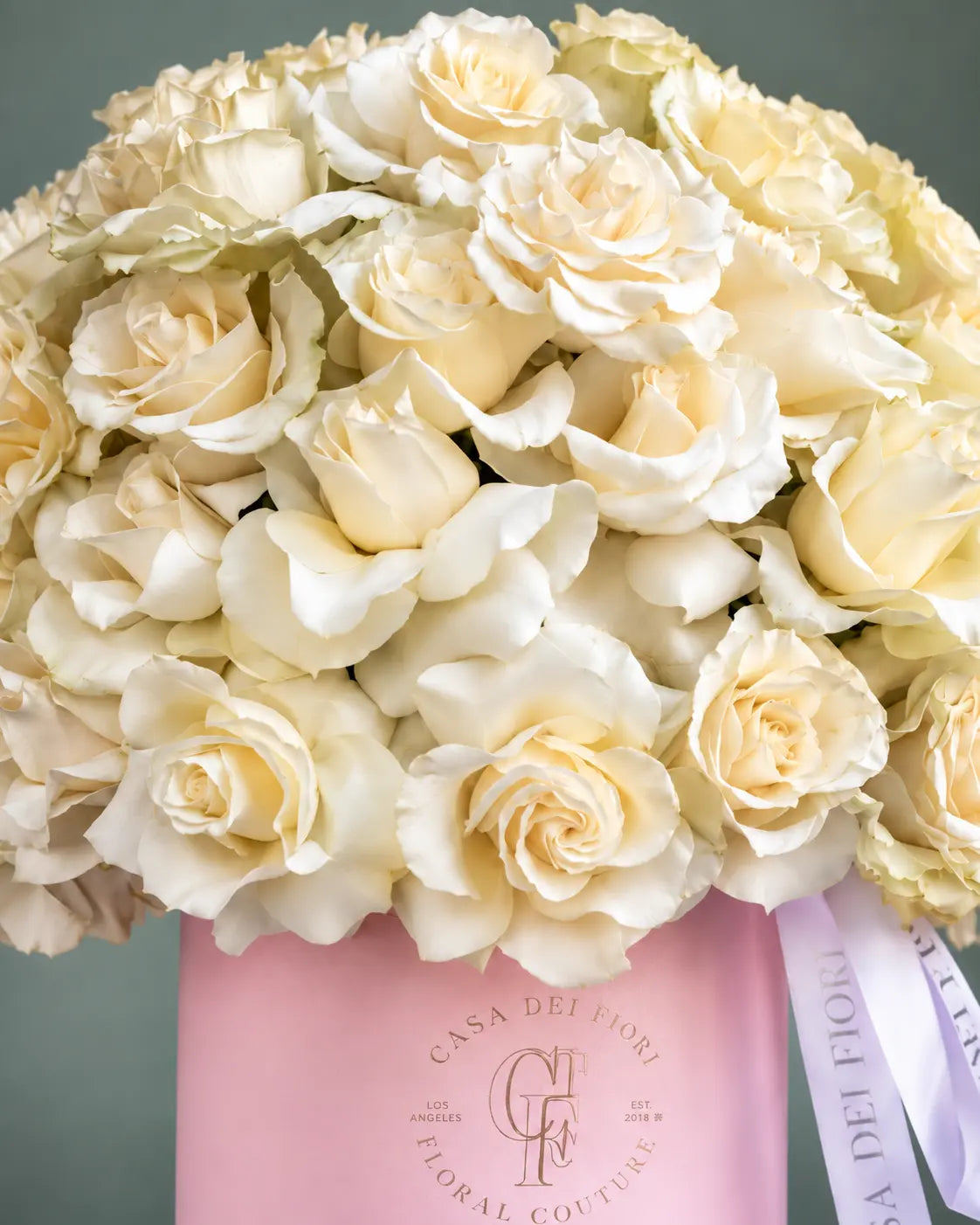 Elegant white roses in a signature pink Casa Dei Fiori box with same-day flower delivery in Los Angeles