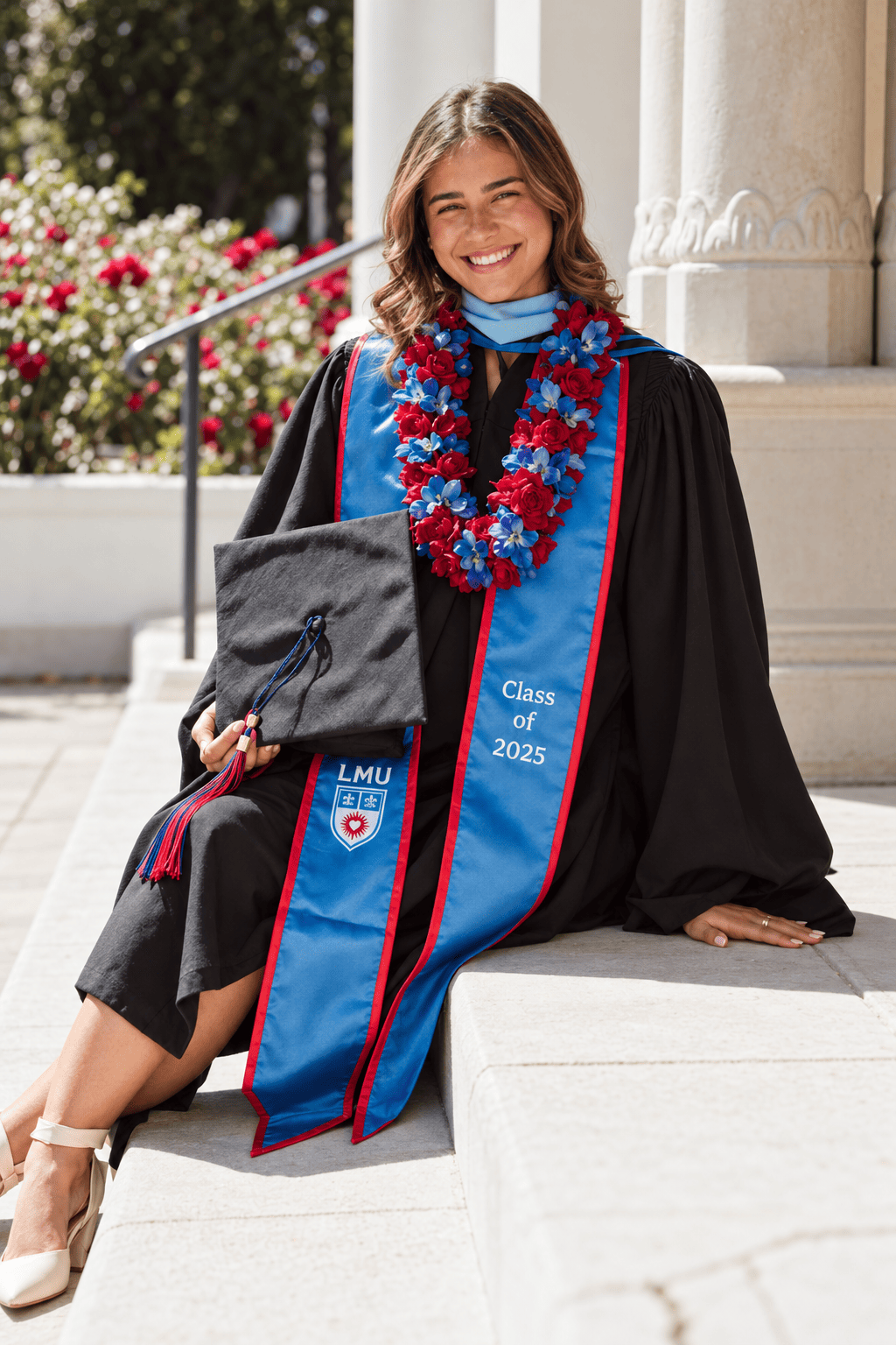 LMU graduate wearing a crimson and blue flower lei in school colors, graduation lei Los Angeles | Casa Dei Fiori
