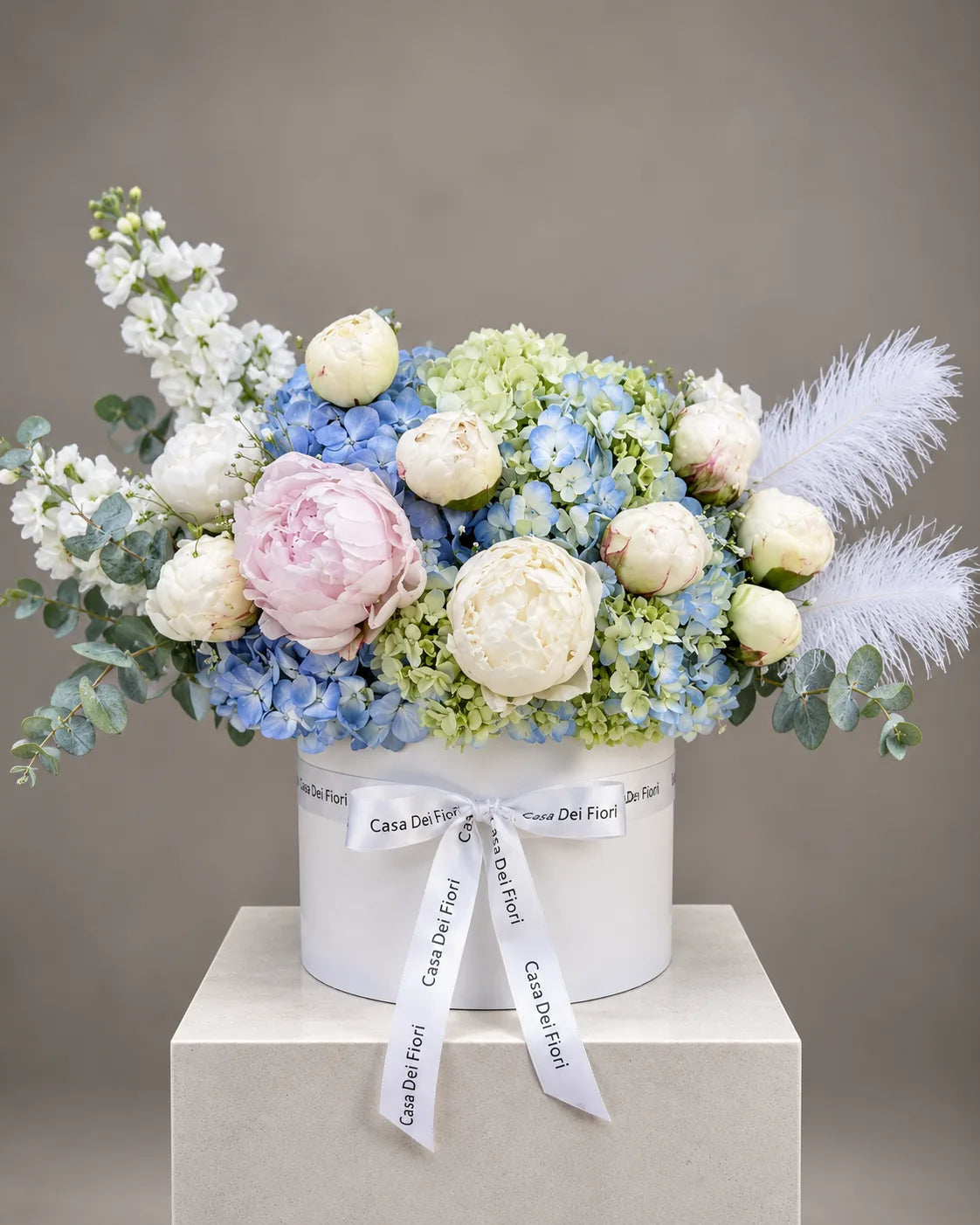 Pink peonies and blue hydrangeas in a luxury hat box with same-day flower delivery in Beverly Hills