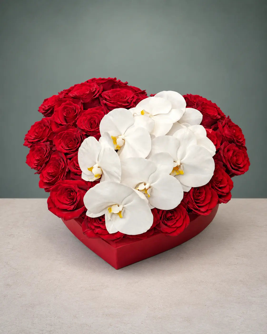 Red roses and white orchids in a heart-shaped box with same-day flower delivery in Beverly Hills