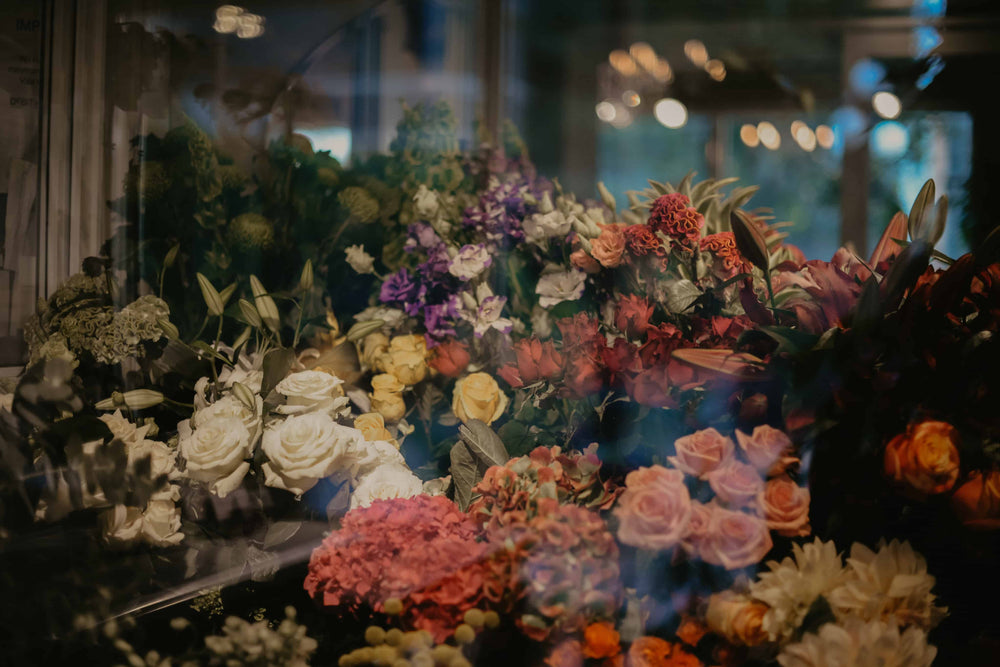 flowers through glass window