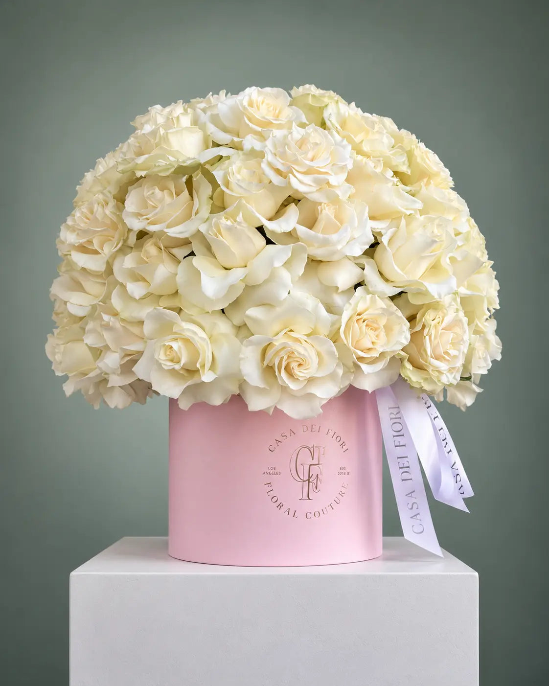 white roses in a pink hat box with same-day delivery in Beverly Hills and Los Angeles