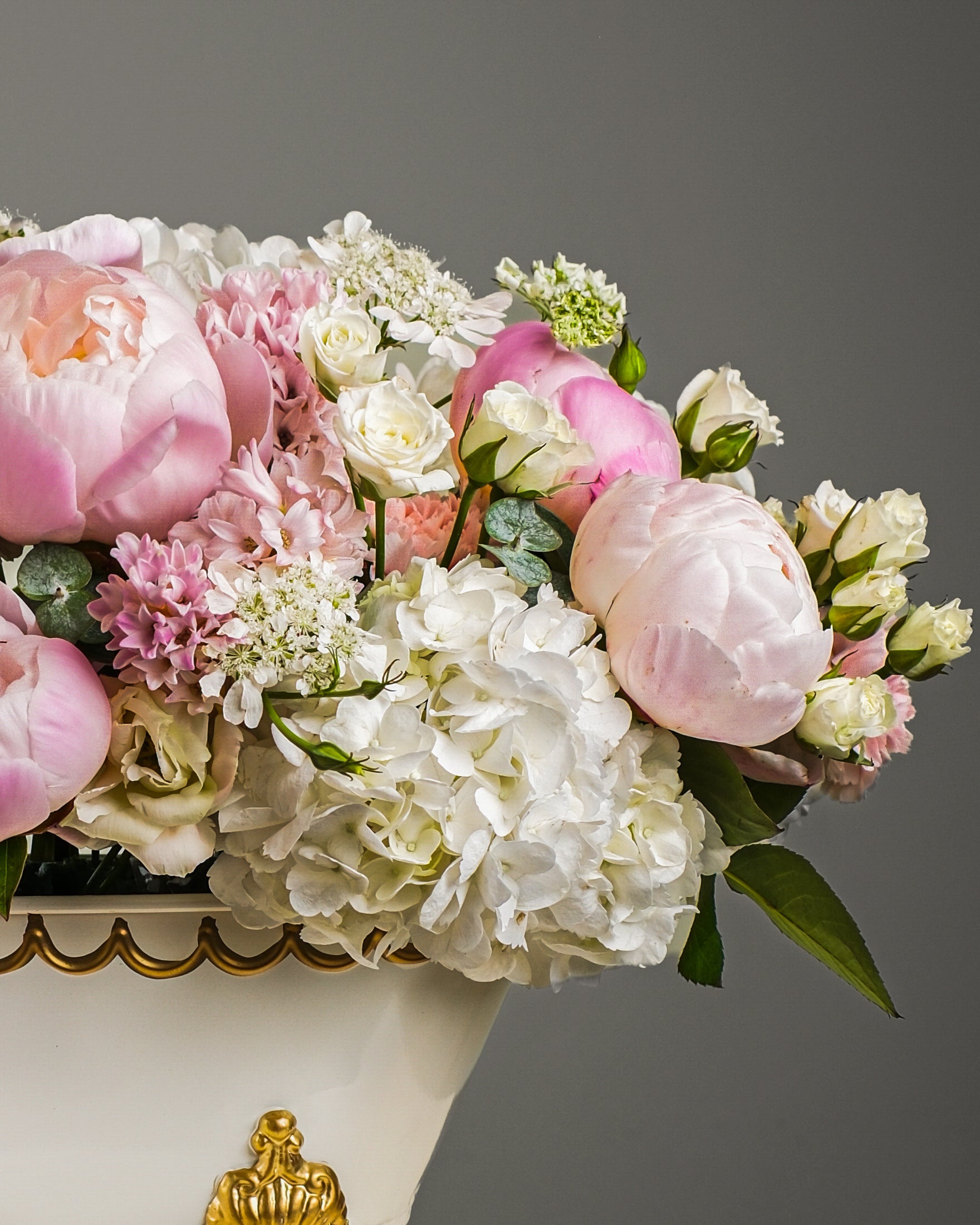 Bathtub floral arrangement with peonies, hydrangeas and ranunculus by Casa Dei Fiori in Beverly Hills Los Angeles