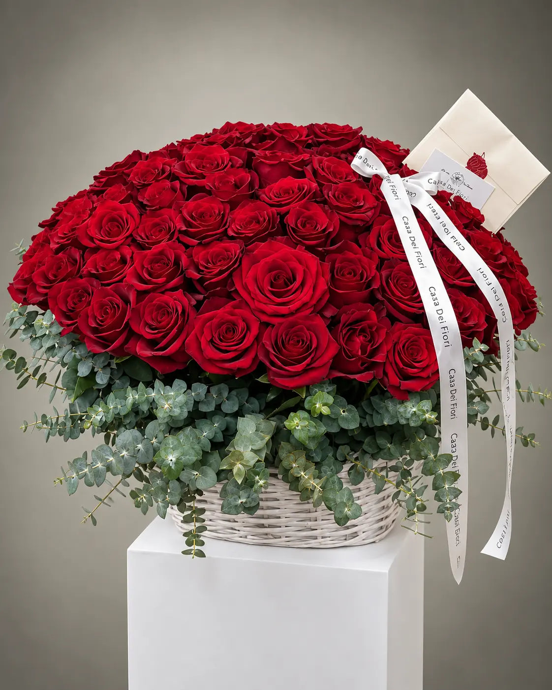 Large red rose arrangement in a white basket by Casa Dei Fiori Los Angeles