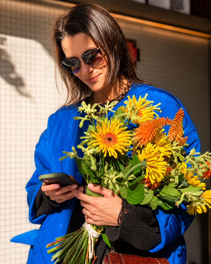 Los Angeles florist bouquet with yellow and orange flowers, fresh greenery, and modern urban floral styling