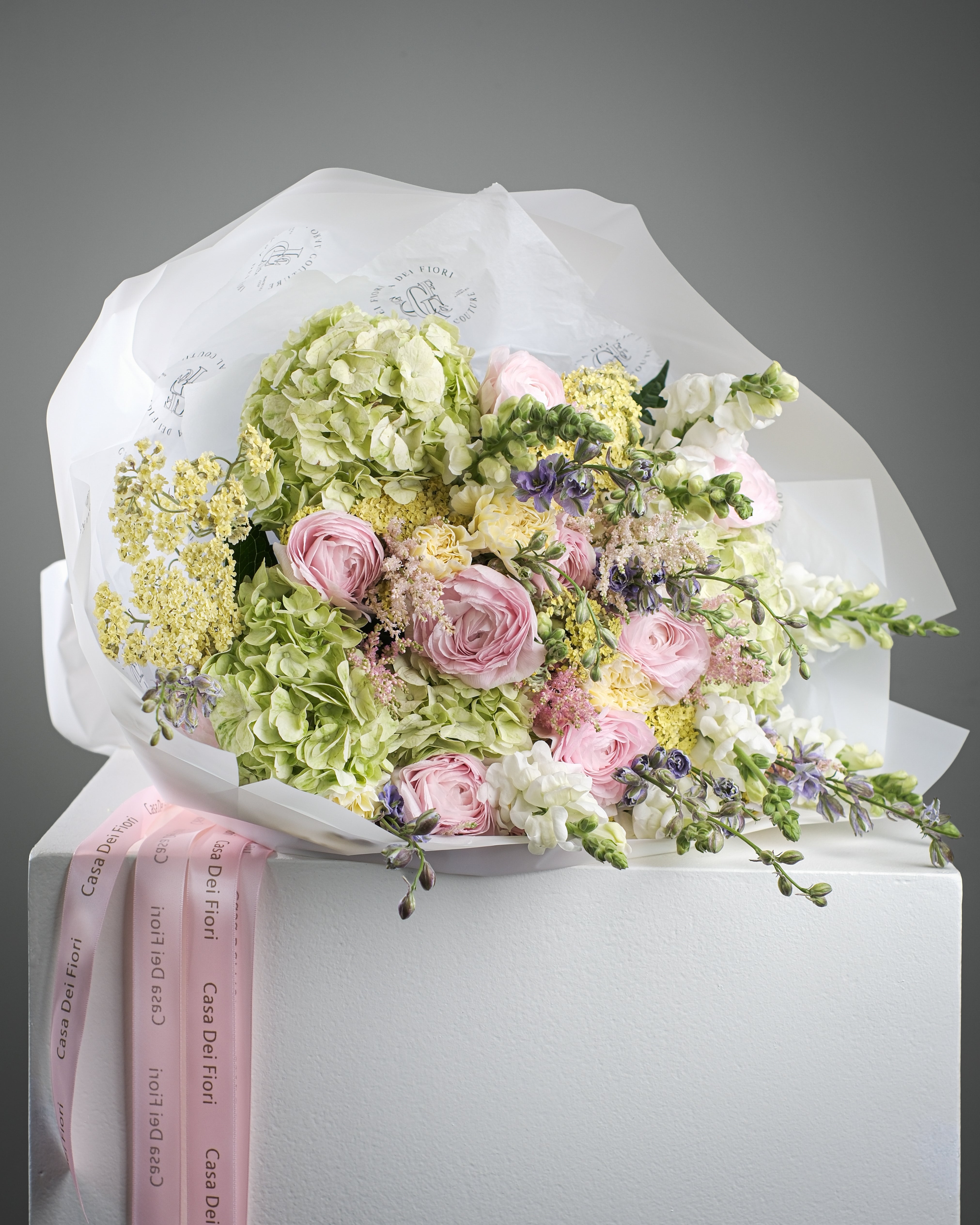 Luxury TUILERIES bouquet with peonies, pink ranunculus, green hydrangea, soft purple delphinium and yellow carnations for flower delivery in Los Angeles and Beverly Hills