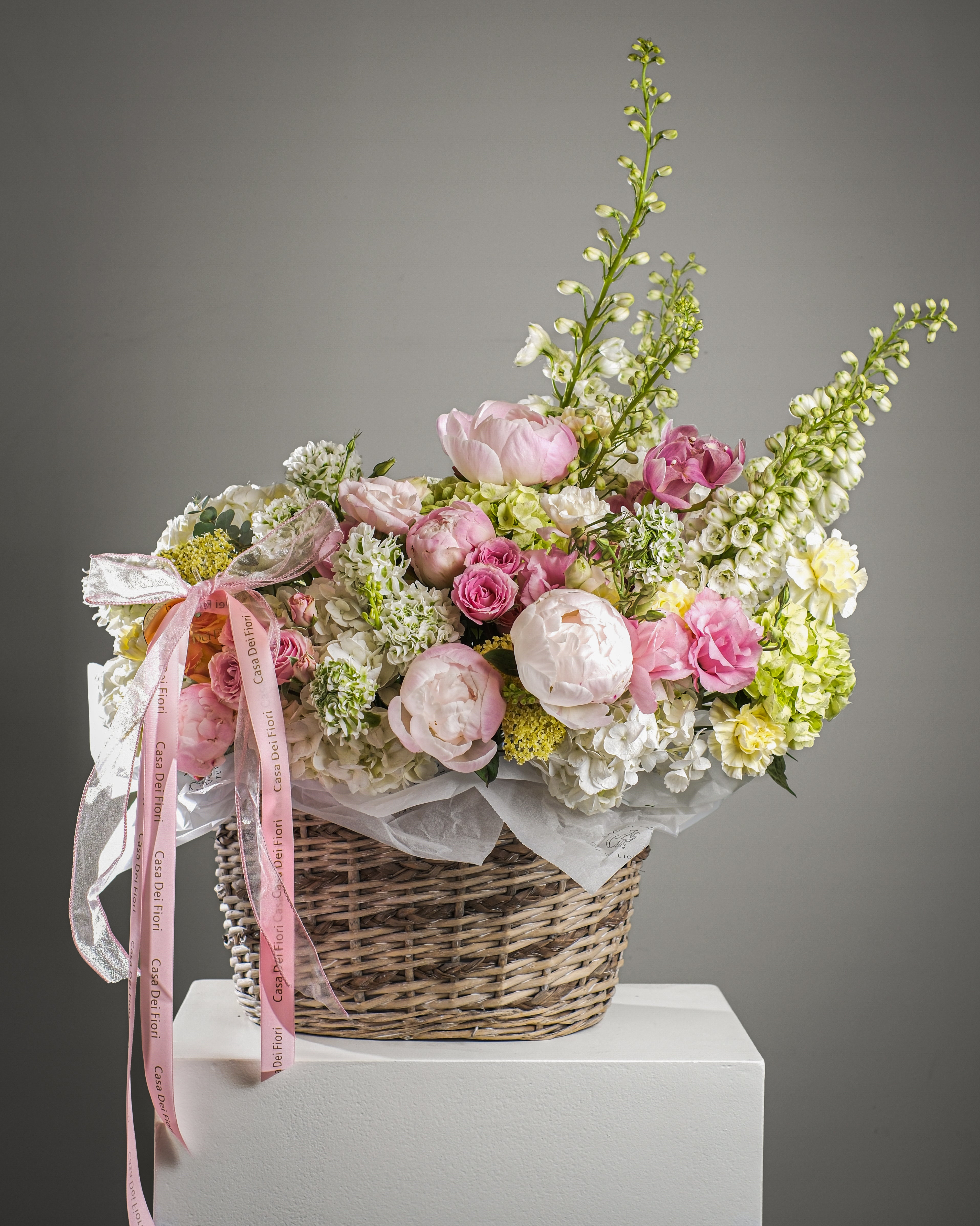 Luxury basket flower arrangement with pink peonies, spray roses, hydrangea and delphinium for flower delivery in Los Angeles and Beverly Hills