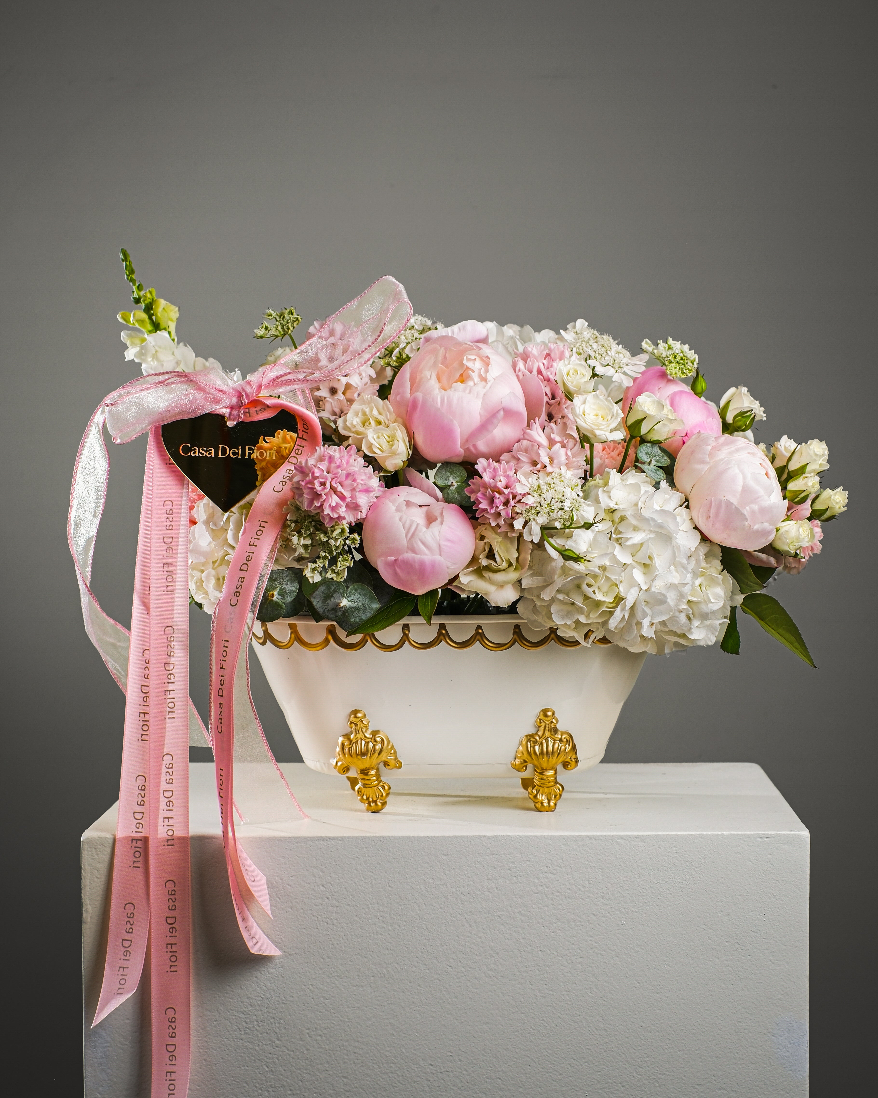 Luxury bathtub flower arrangement with white-pink peonies, hydrangeas, ranunculus and eucalyptus for flower delivery in Los Angeles and Beverly Hills