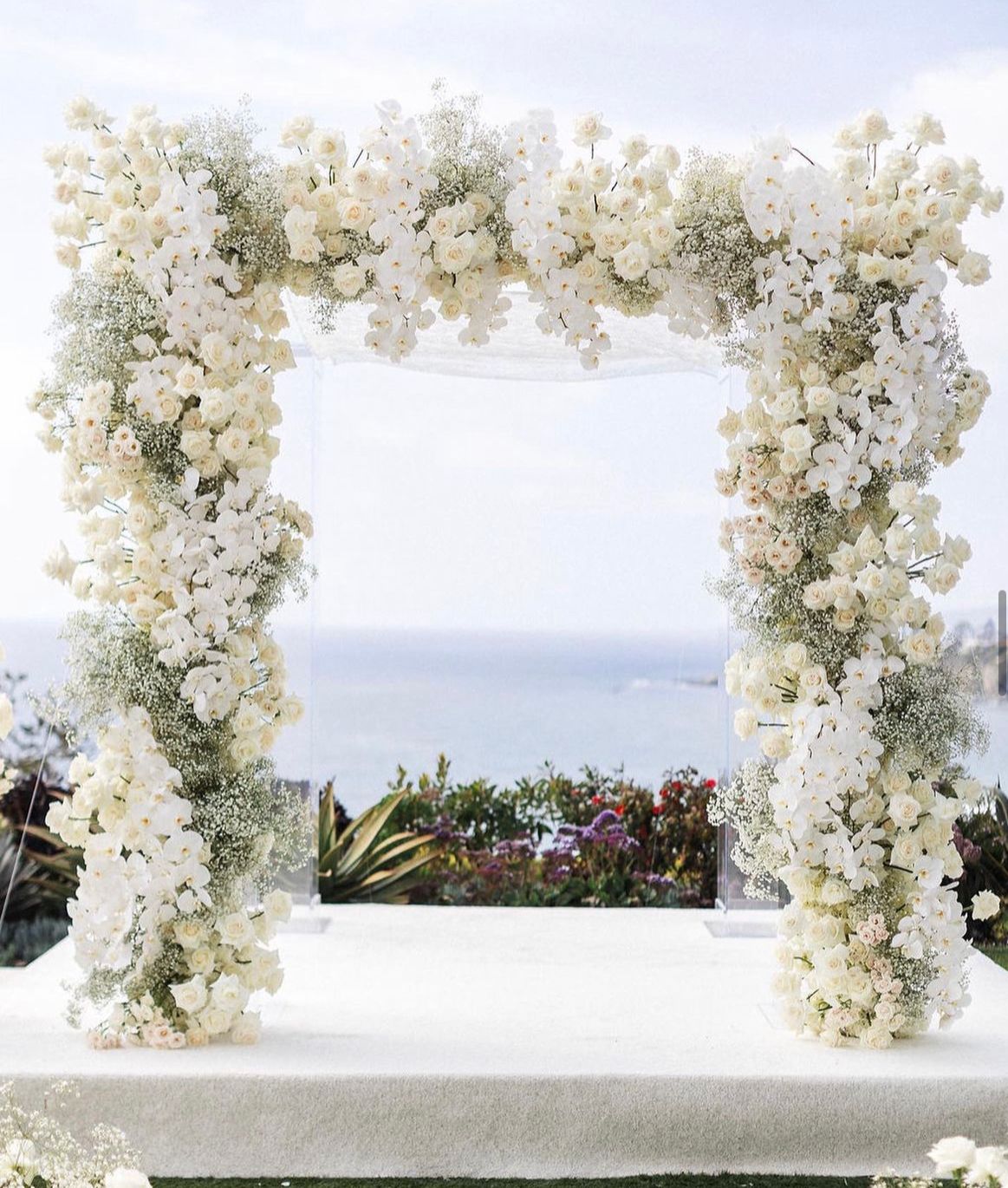 Romantic floral arch for scenic Santa Barbara ceremony