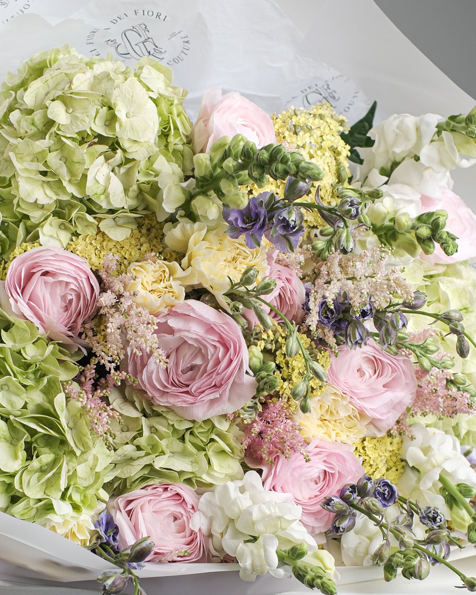 TUILERIES bouquet with peonies, ranunculus, hydrangea, delphinium and soft yellow flowers by Casa Dei Fiori in Beverly Hills