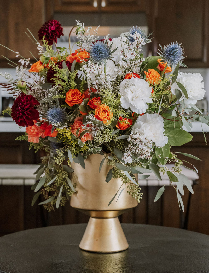 Thanksgiving home flower subscription arrangement for a residential interior