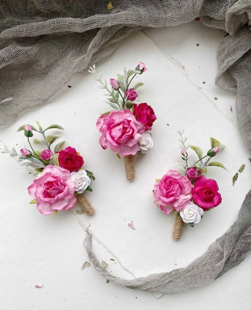 wedding boutonniere with roses and greenery