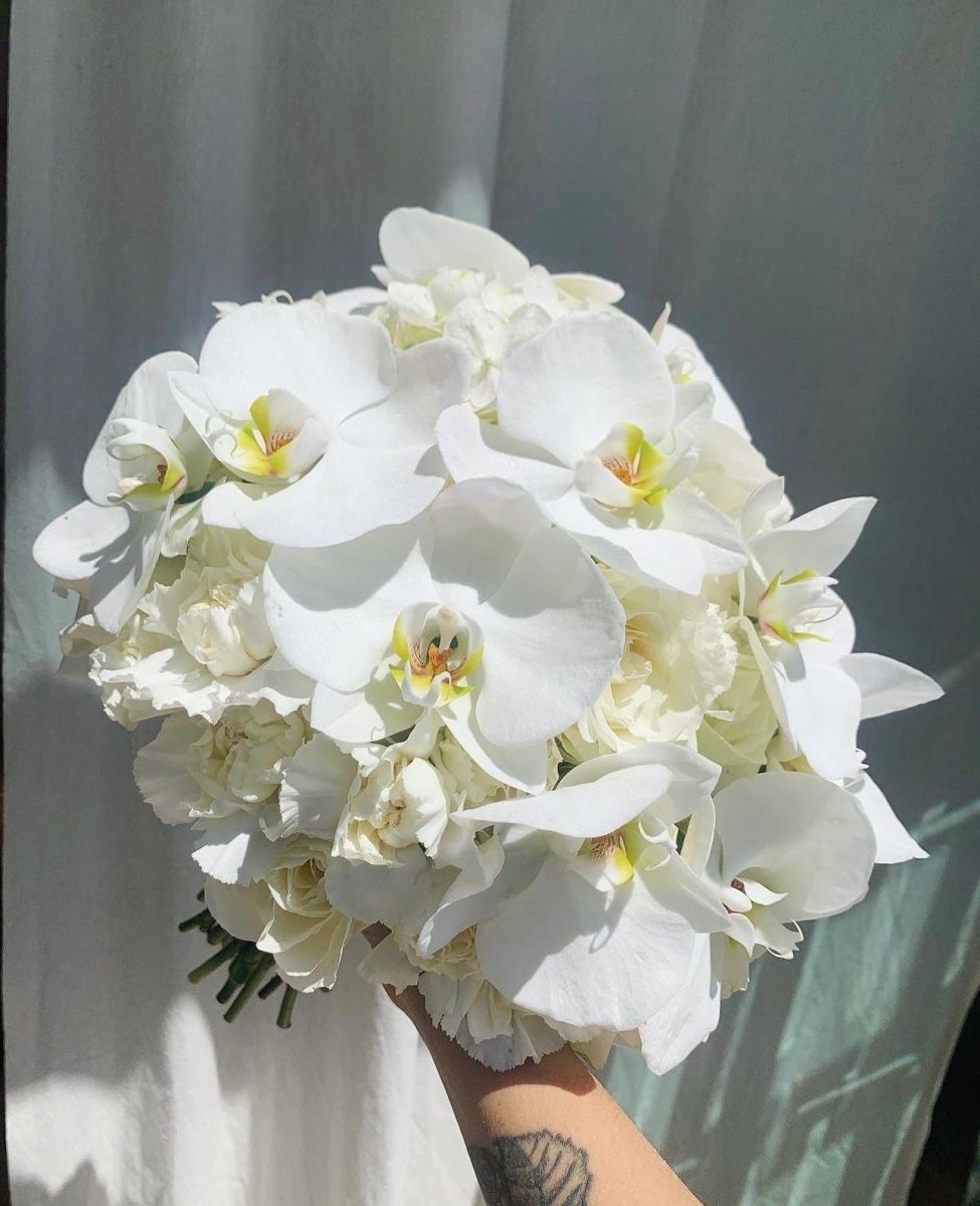  white bridal bouquet with orchids